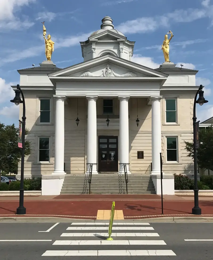 Goldsboro City Hall, a white columned building in downtown Goldsboro, NC